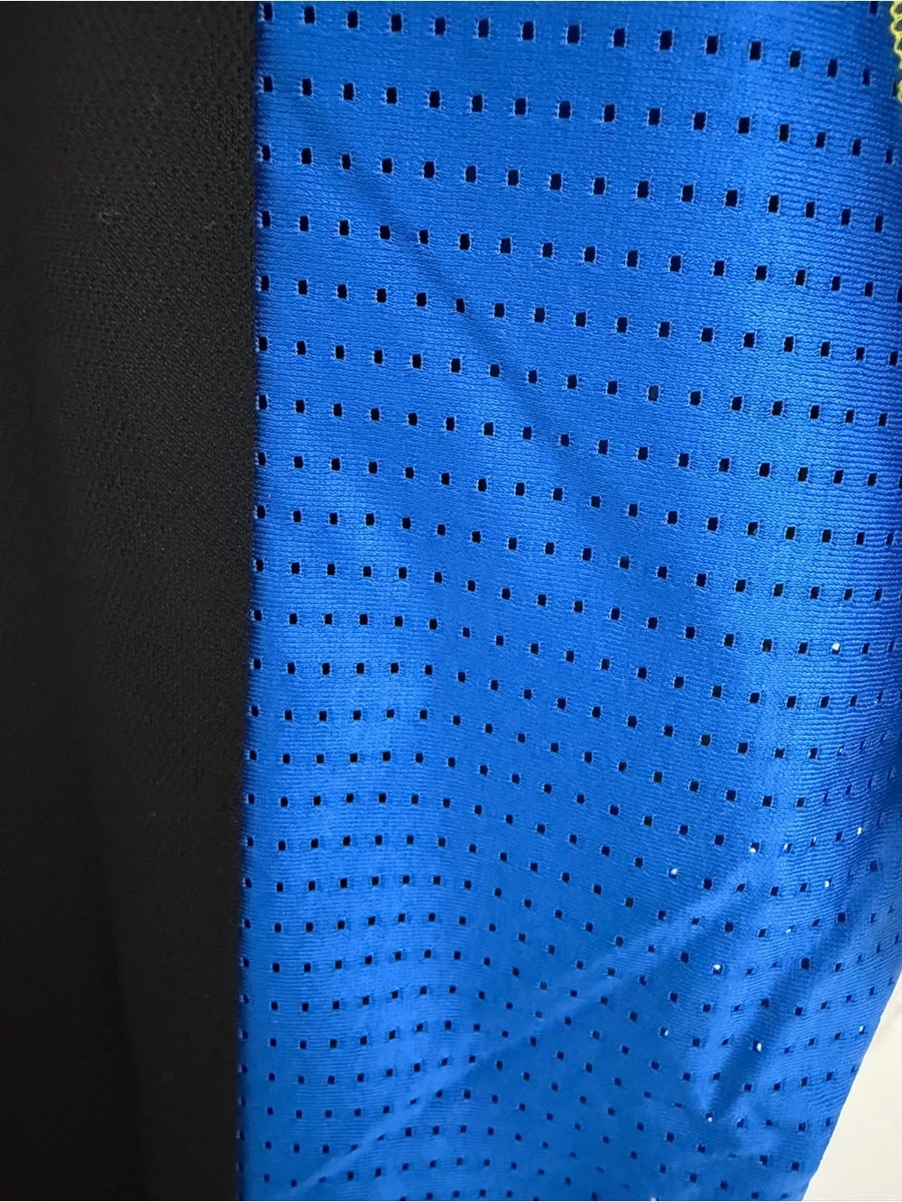 Lacoste Black Polo with Blue Panels and Green Accents